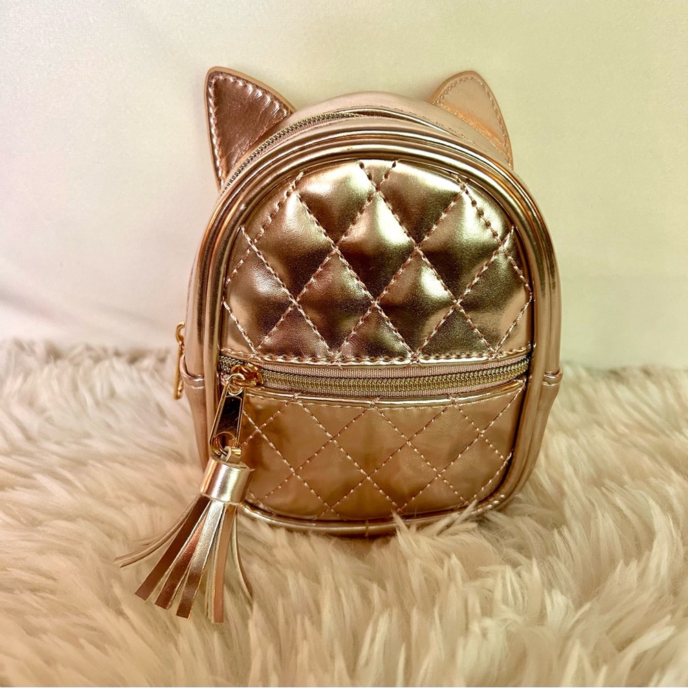 Mini backpack keychain, metallic rose gold from Claire’s. Brand New - Pink Gold